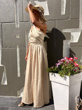 Robe longue beige dos ouvert asymétrique